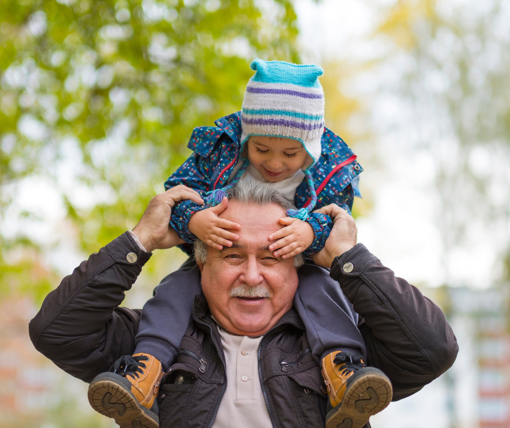 Man carrying child on his shoulders