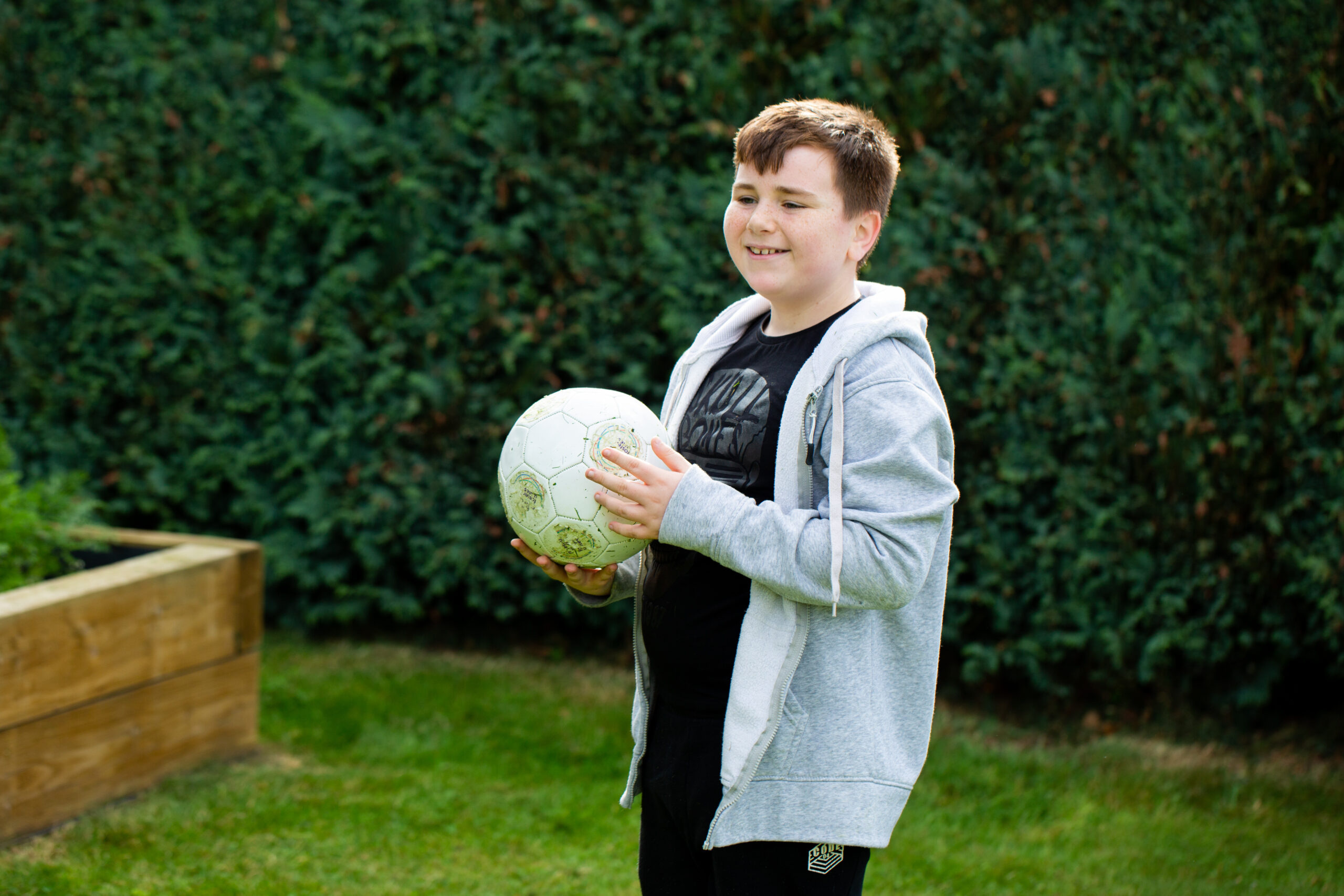 Boy holding football